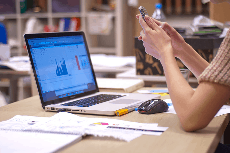 Girl preparing charts on Laptop